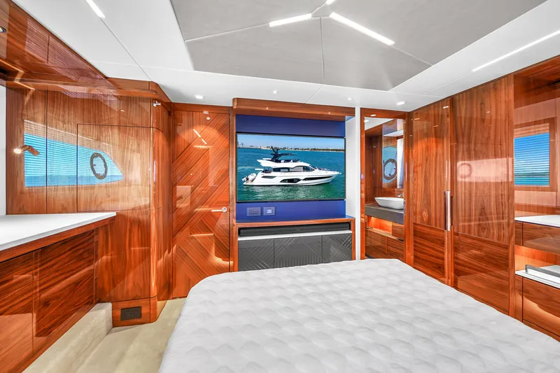 Atkun Yacht Photos Pics Luxurious bedroom interior of 2021 Sunseeker 68 Manhattan yacht with wood finishes.