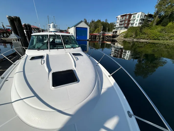  Yacht Photos Pics 2005 Tiara Yachts 3600 Sovran docked near waterfront buildings and calm water.