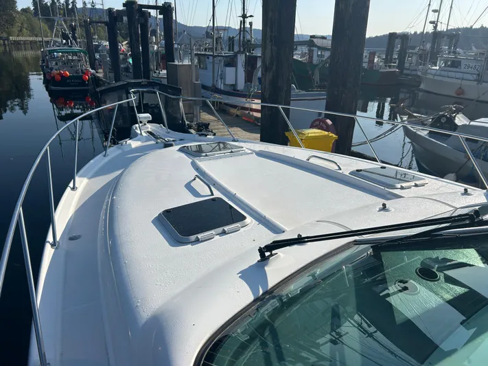  Yacht Photos Pics 2005 Tiara Yachts 3600 Sovran docked at a marina, showcasing sleek design and spacious deck.