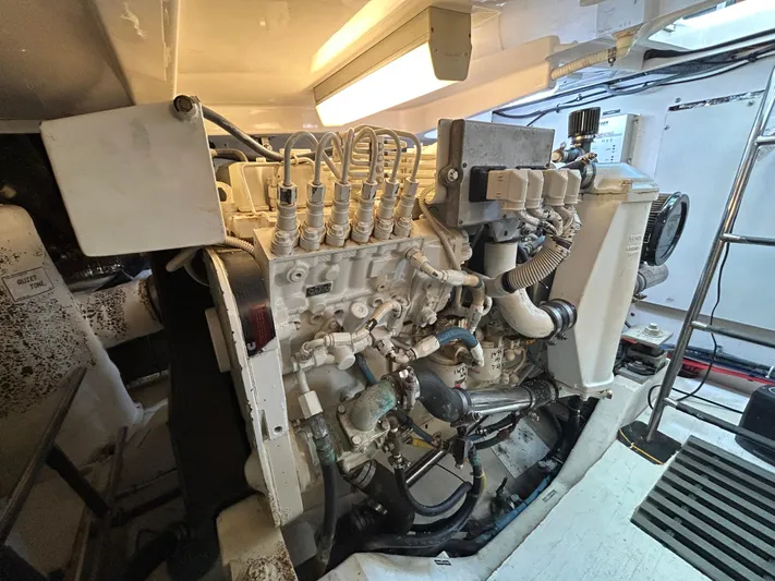  Yacht Photos Pics Engine room of a 2005 Tiara Yachts 3600 Sovran, showcasing detailed machinery components.