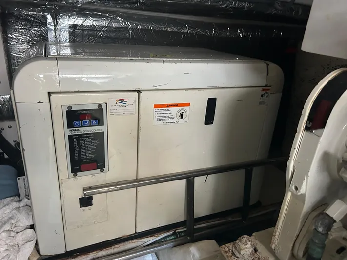  Yacht Photos Pics Engine room of 2005 Tiara Yachts 3600 Sovran with generator unit.