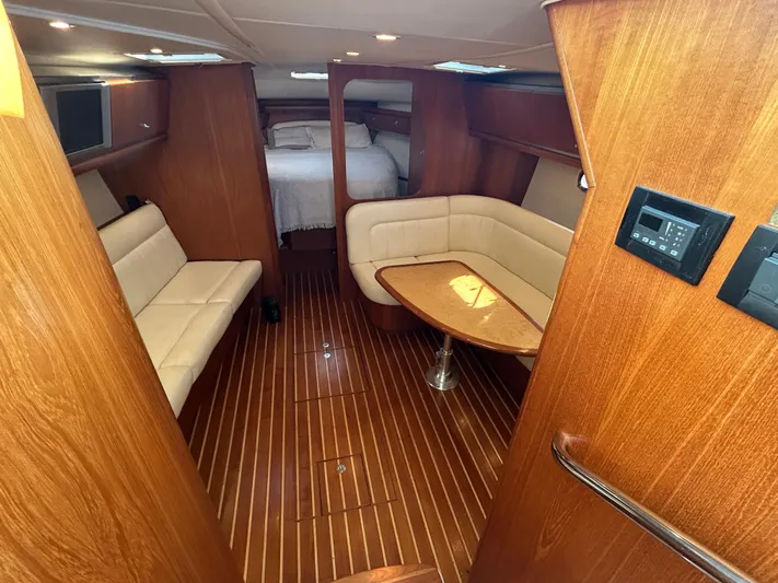  Yacht Photos Pics Luxurious interior of 2005 Tiara Yachts 3600 Sovran with wood finish and comfortable seating.