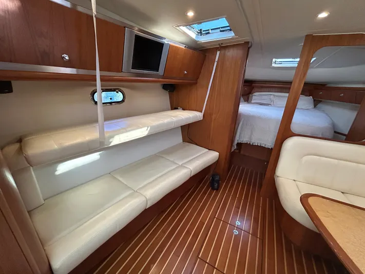  Yacht Photos Pics Luxurious 2005 Tiara Yachts 3600 Sovran interior with wood finish and comfortable seating.
