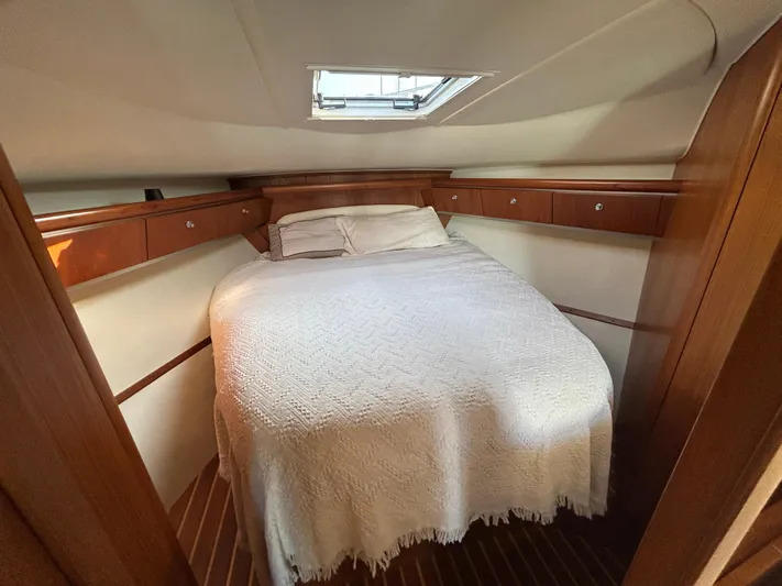  Yacht Photos Pics 2005 Tiara Yachts 3600 Sovran cabin with cozy bed and wooden cabinetry.