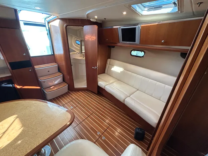  Yacht Photos Pics 2005 Tiara Yachts 3600 Sovran interior with wood flooring and white seating.