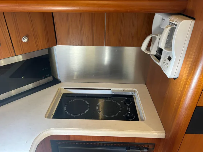 Yacht Photos Pics 2005 Tiara Yachts 3600 Sovran kitchen with stove and coffee maker.
