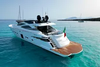 Luxurious 2008 Pershing 90 yacht on clear turquoise waters, featuring sleek design and Italian flag.