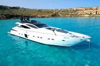 2008 Pershing 90 yacht in clear turquoise waters near rocky coastline.