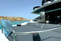 Luxurious 2008 Pershing 90 yacht deck with cushions, towel, and ocean view.