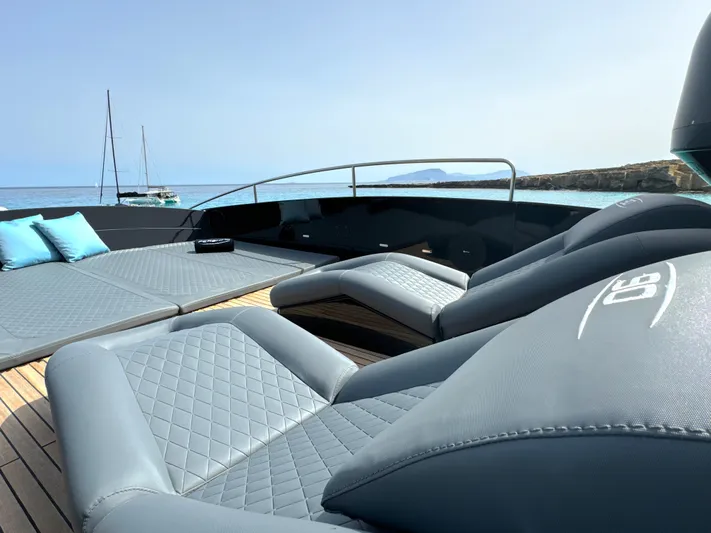 Thyke III Yacht Photos Pics Luxurious 2008 Pershing 90 yacht deck with elegant seating and ocean view.