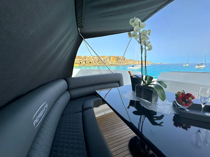 Thyke III Yacht Photos Pics Luxurious 2008 Pershing 90 yacht interior with elegant seating and ocean view.