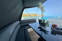 Luxurious 2008 Pershing 90 yacht interior with elegant seating and ocean view.