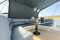 Luxurious seating area on a 2008 Pershing 90 yacht with elegant table and decor.