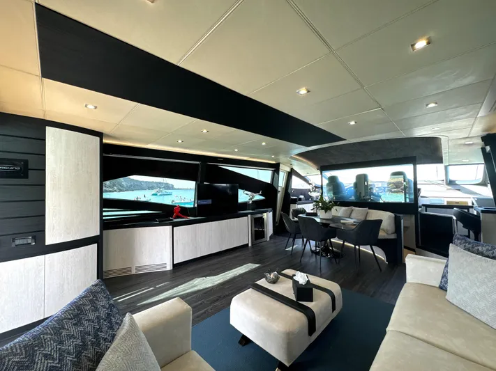 Thyke III Yacht Photos Pics Luxurious interior of a 2008 Pershing 90 yacht with modern furnishings and large windows.