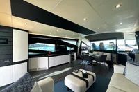 Luxurious interior of a 2008 Pershing 90 yacht with modern furnishings and large windows.