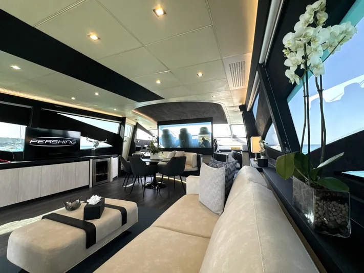 Thyke III Yacht Photos Pics Luxurious interior of a 2008 Pershing 90 yacht with modern furnishings and elegant decor.