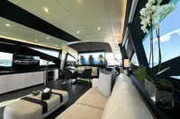 Luxurious interior of a 2008 Pershing 90 yacht with modern furnishings and elegant decor.