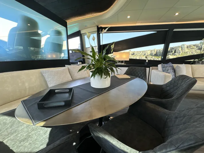 Thyke III Yacht Photos Pics Luxurious interior of a 2008 Pershing 90 yacht with elegant seating and decor.