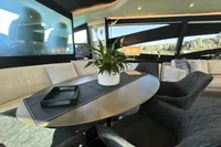 Luxurious interior of a 2008 Pershing 90 yacht with elegant seating and decor.