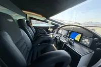 Interior cockpit of 2008 Pershing 90 yacht with modern navigation equipment and luxurious seating.