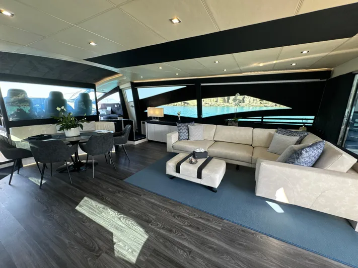 Thyke III Yacht Photos Pics Luxurious interior of a 2008 Pershing 90 yacht with elegant seating and dining area.
