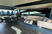 Luxurious interior of a 2008 Pershing 90 yacht with elegant seating and dining area.