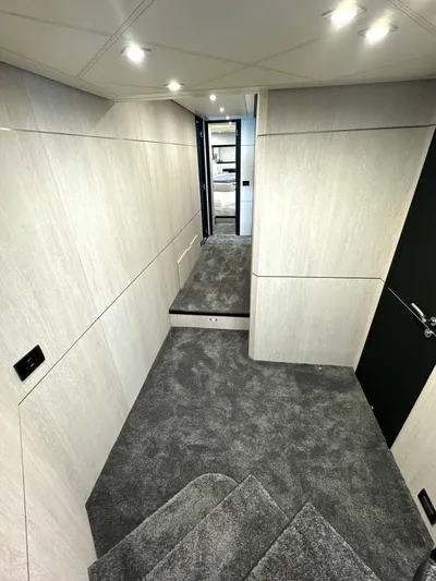 Thyke III Yacht Photos Pics Interior of a 2008 Pershing 90 yacht with modern design and carpeted flooring.