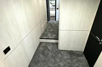 Interior of a 2008 Pershing 90 yacht with modern design and carpeted flooring.