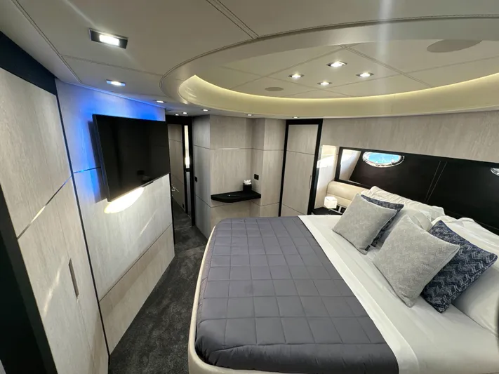 Thyke III Yacht Photos Pics Luxurious bedroom interior of a 2008 Pershing 90 yacht with modern design and ambient lighting.