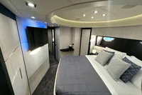 Luxurious bedroom interior of a 2008 Pershing 90 yacht with modern design and ambient lighting.