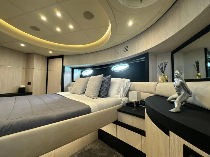 Thyke III Yacht Photos Pics Luxurious bedroom interior of 2008 Pershing 90 yacht with modern decor and ambient lighting.