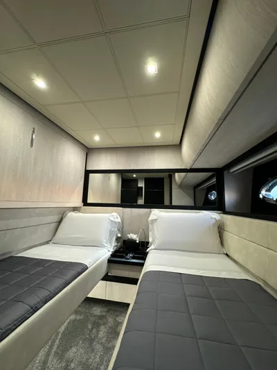 Thyke III Yacht Photos Pics Luxurious twin cabin interior of 2008 Pershing 90 yacht with modern design and ambient lighting.