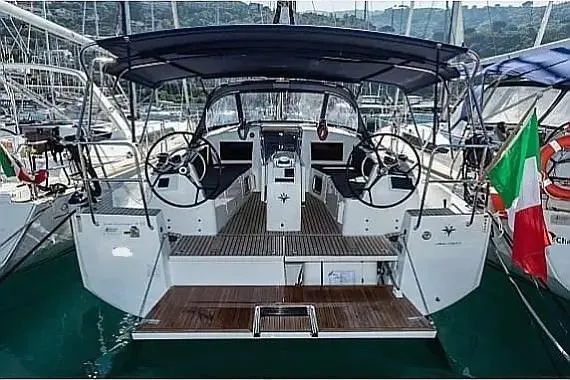  Yacht Photos Pics 2021 Jeanneau Sun Odyssey 410 sailboat with dual steering wheels, docked in a marina.