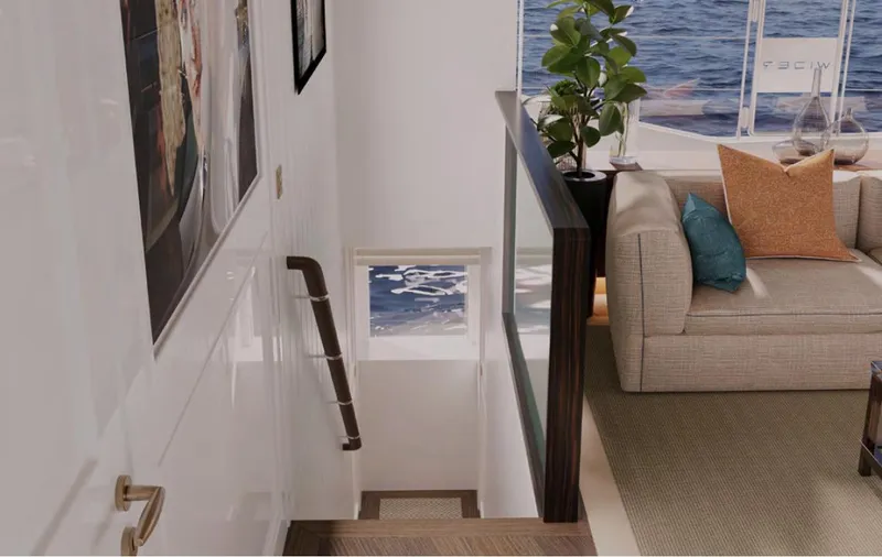  Yacht Photos Pics Luxurious interior of Wider 76 yacht, featuring elegant staircase, cozy seating, and ocean view.