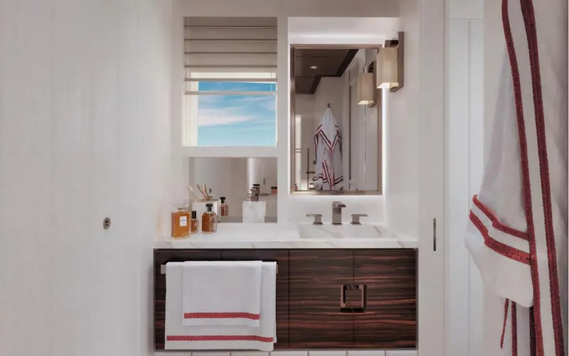 Yacht Photos Pics Modern bathroom with wooden vanity, mirror, and towels; Wider 76, 2025 model.