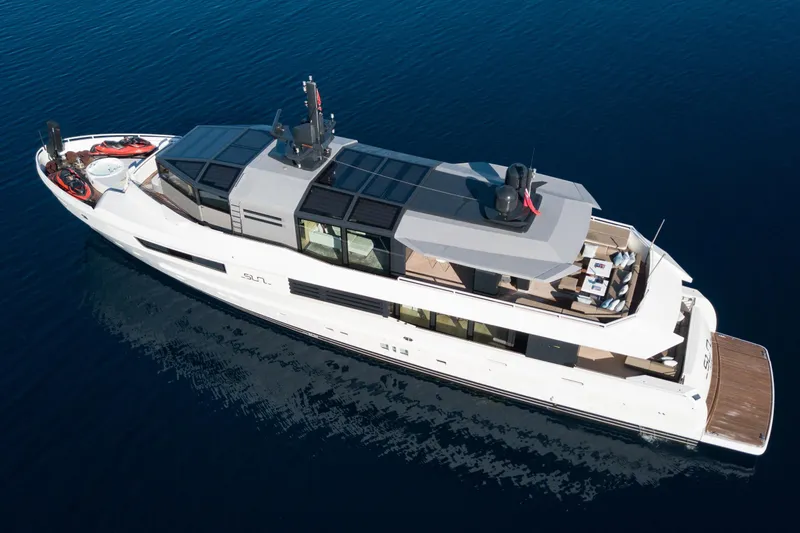 Sun Yacht Photos Pics Luxurious 2012 Arcadia Yachts 115 model cruising on calm blue waters.