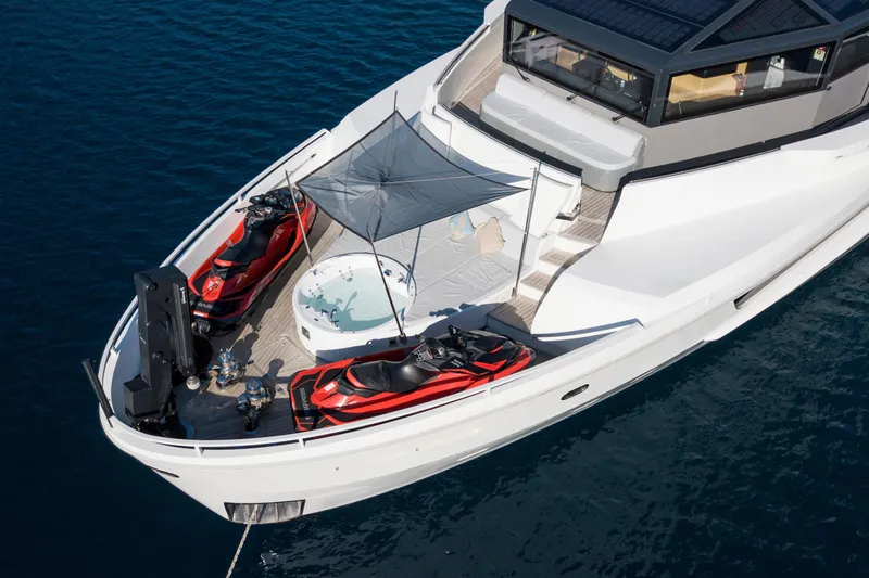 Sun Yacht Photos Pics Luxurious 2012 Arcadia Yachts 115 with jet skis and jacuzzi on deck.