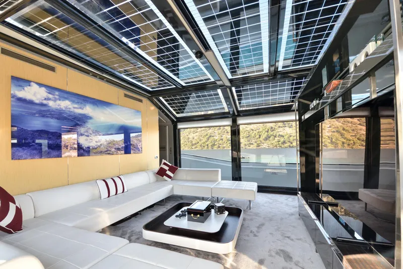 Sun Yacht Photos Pics Luxurious interior of 2012 Arcadia Yachts 115 with panoramic windows and modern decor.