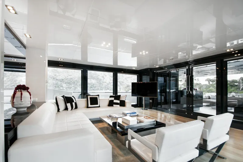 Sun Yacht Photos Pics Luxurious interior of 2012 Arcadia Yachts 115, featuring modern white seating and large windows.