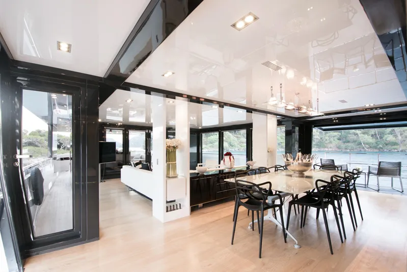 Sun Yacht Photos Pics Luxurious interior of 2012 Arcadia Yachts 115, featuring elegant dining area with scenic views.