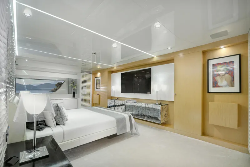 Sun Yacht Photos Pics Luxurious bedroom interior on 2012 Arcadia Yachts 115, featuring modern decor and scenic window view.