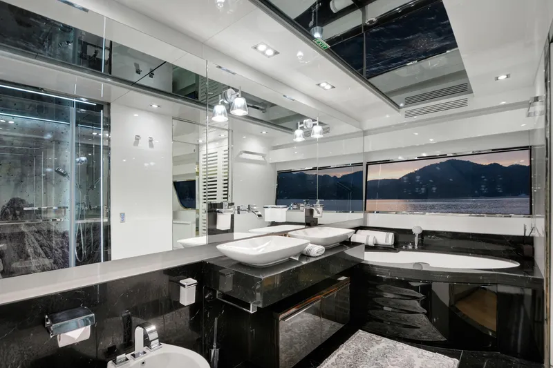 Sun Yacht Photos Pics Luxurious bathroom on 2012 Arcadia Yachts 115, featuring modern fixtures and scenic ocean view.