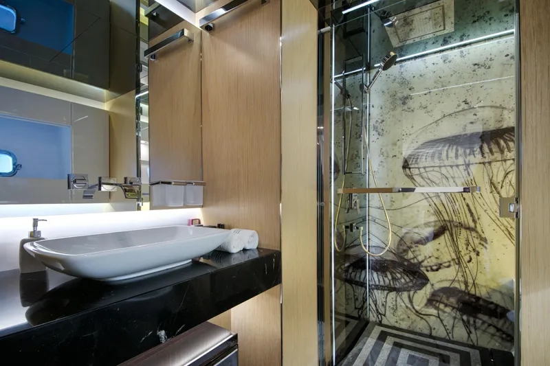 Sun Yacht Photos Pics Luxurious bathroom on 2012 Arcadia Yachts 115, featuring modern sink and artistic shower design.