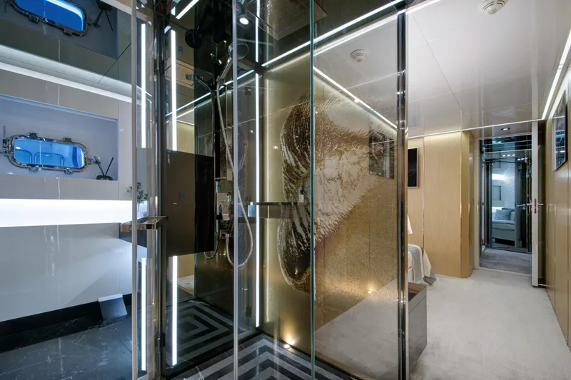 Sun Yacht Photos Pics Luxurious interior of 2012 Arcadia Yachts 115, featuring modern glass shower and elegant design.