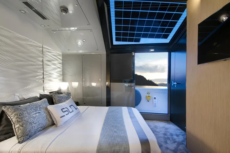 Sun Yacht Photos Pics Luxurious bedroom interior of 2012 Arcadia Yachts 115 with modern design and scenic view.