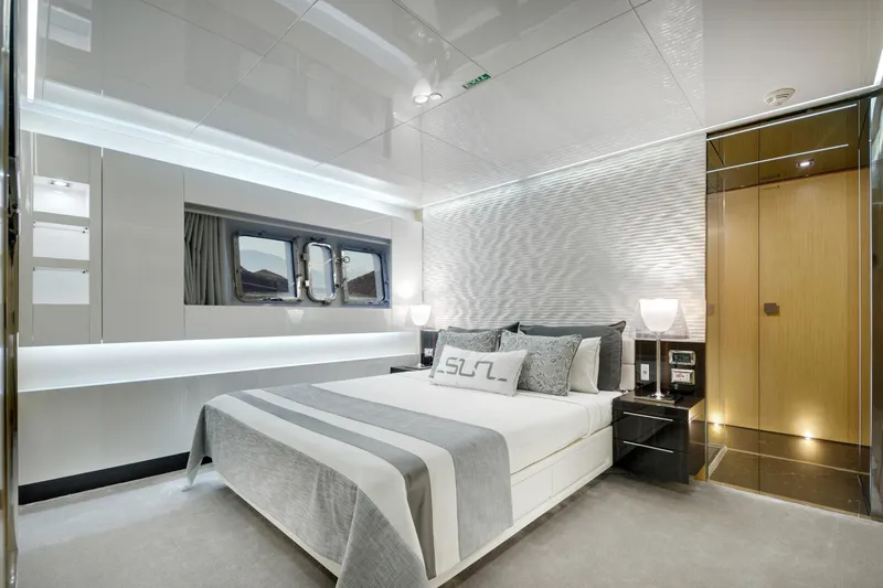 Sun Yacht Photos Pics Luxurious bedroom interior on 2012 Arcadia Yachts 115, featuring modern design and elegant decor.
