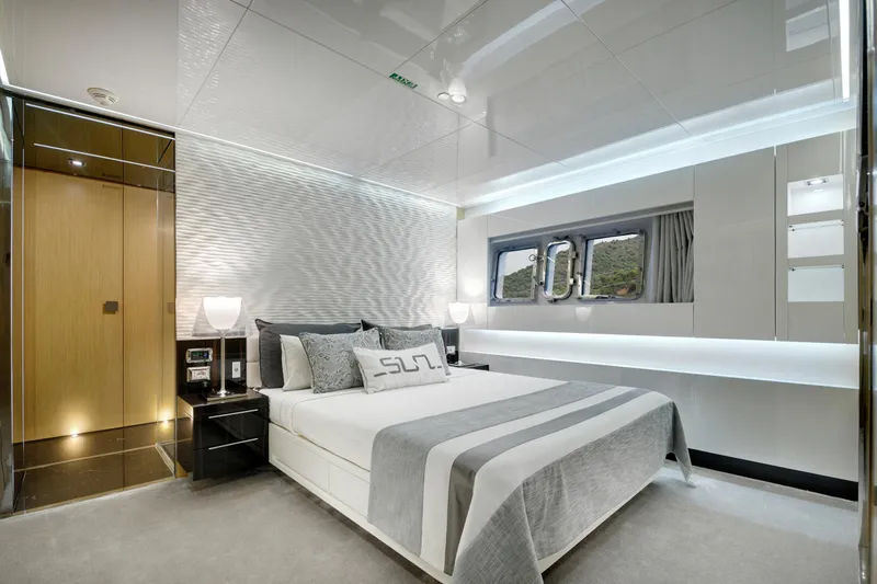 Sun Yacht Photos Pics Luxurious bedroom interior of 2012 Arcadia Yachts 115, featuring modern design and elegant decor.