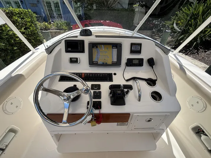  Yacht Photos Pics Control panel of a 2015 Pursuit S 280 Sport boat with navigation equipment.
