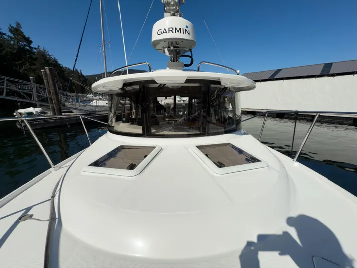  Yacht Photos Pics 2018 Ranger Tugs R-29 S boat docked, featuring Garmin equipment, under clear blue sky.