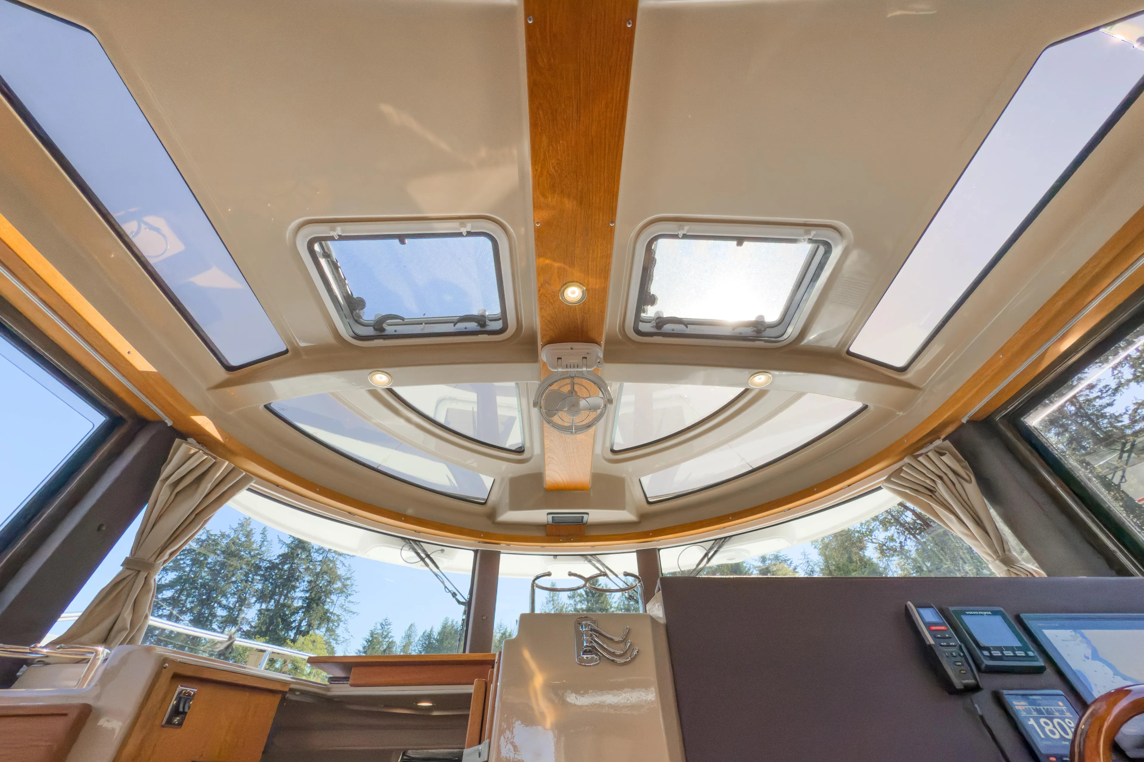  Yacht Photos Pics 2018 Ranger Tugs R-29 S interior with skylights and wood accents.